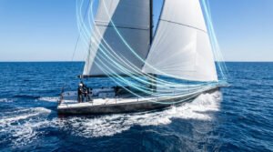 Voilier en mer avec des lignes bleues illustrant le flux d'air autour des voiles.